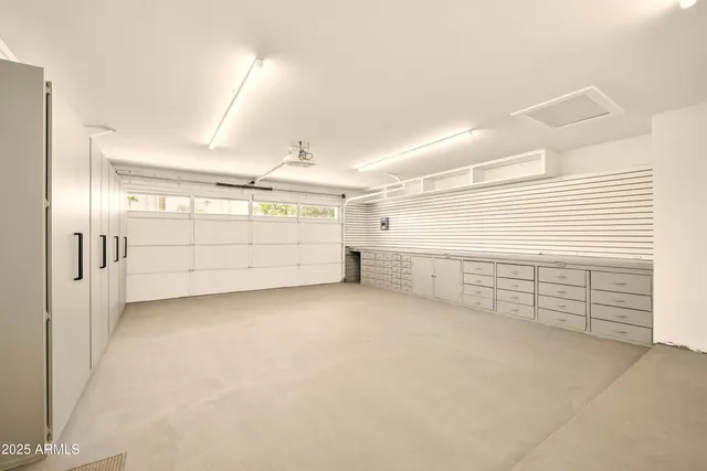 a view of house with a big yard and potted plants