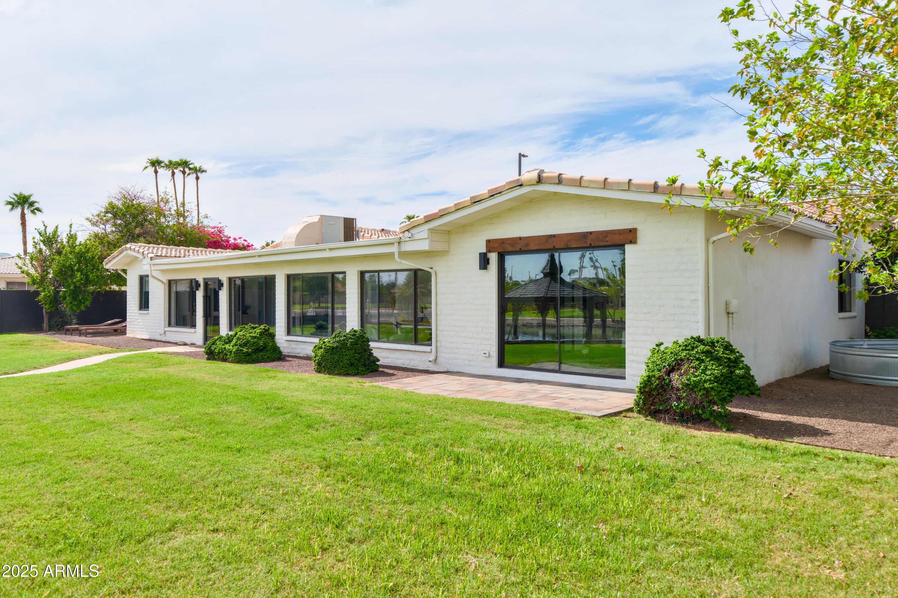 2425 West Impala Circle Mesa, AZ 85202 - Photo 49 of 55 a front view of a house with garden
