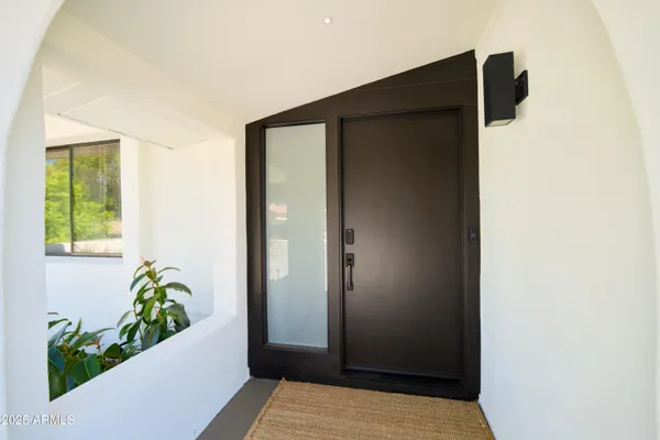 a view of a chair and table in the patio