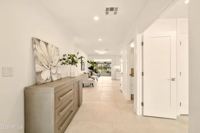 a view of a bathroom with a tub shower and mirror