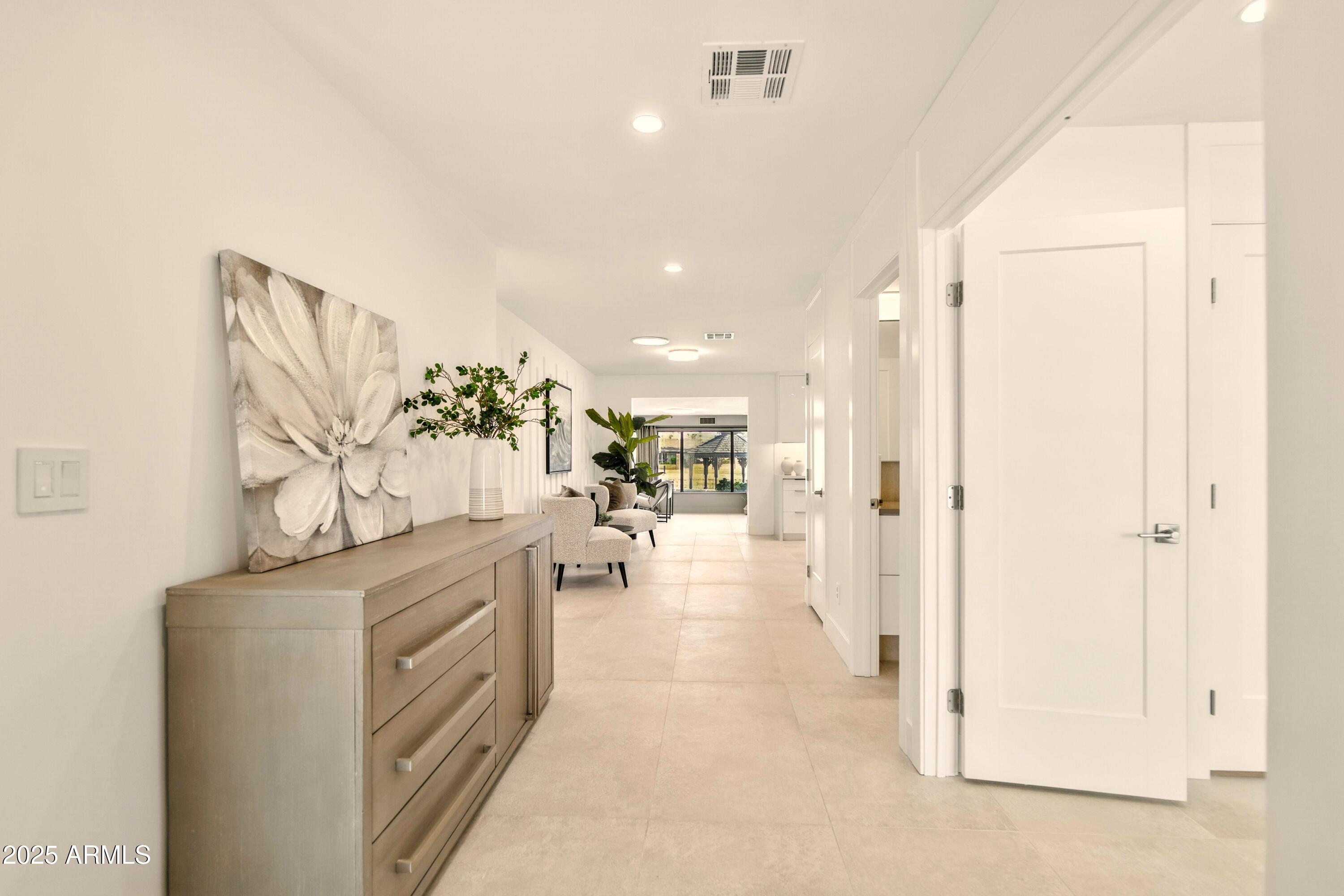 2425 West Impala Circle Mesa, AZ 85202 - Photo 9 of 55 a view of a hallway with chandelier
