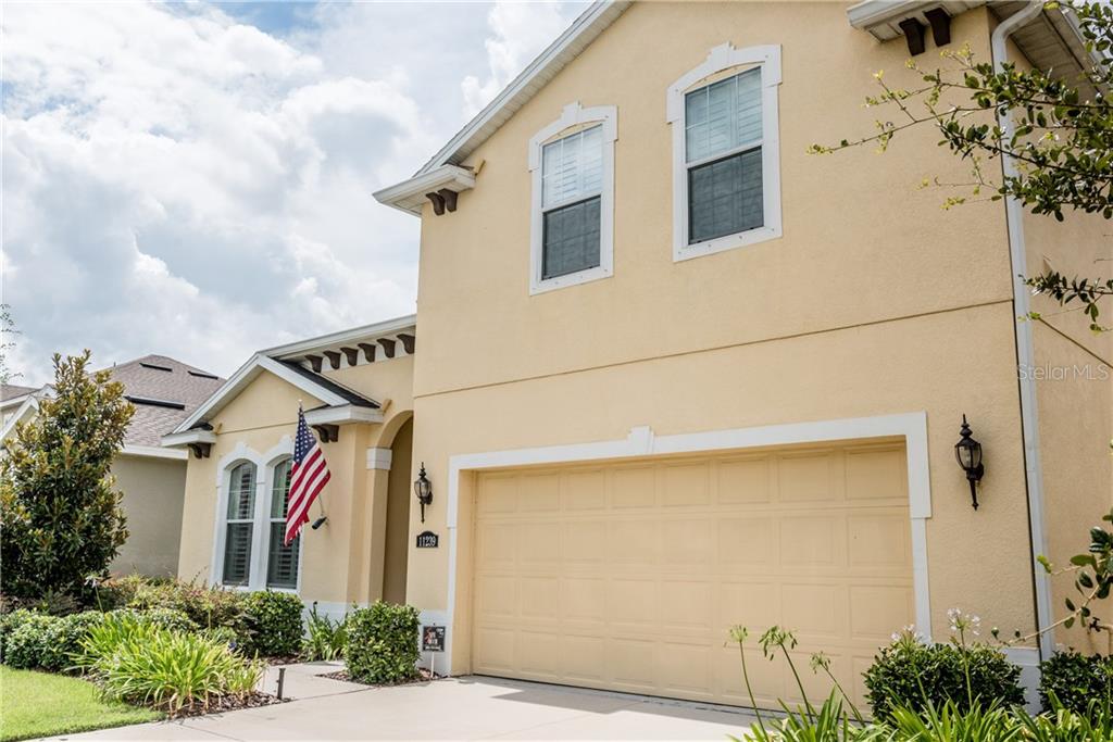 11239 Spring Point Circle Riverview, FL 33579 - Photo 1 of 1 a front view of a house with a yard and garage