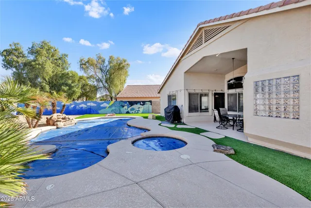 an aerial view of residential house with outdoor space and seating