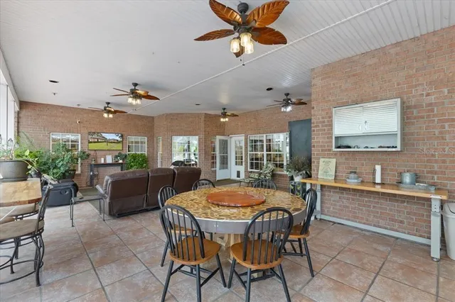 a living room with furniture a rug and white walls