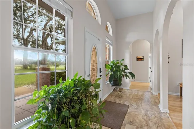 a bed room with a bed and a chandelier