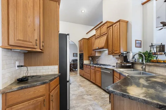 a bedroom with a bed window and couch