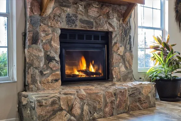 a view of a lake with couches chairs and city view