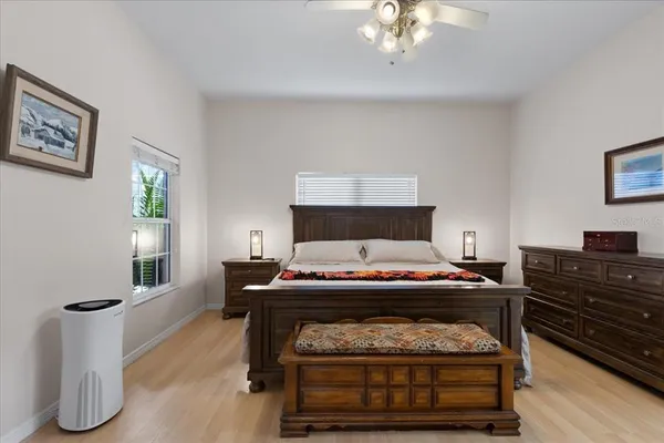 a view of a lake with a big yard and potted plants