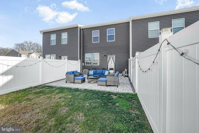 a view of a house with sitting area and view of a house