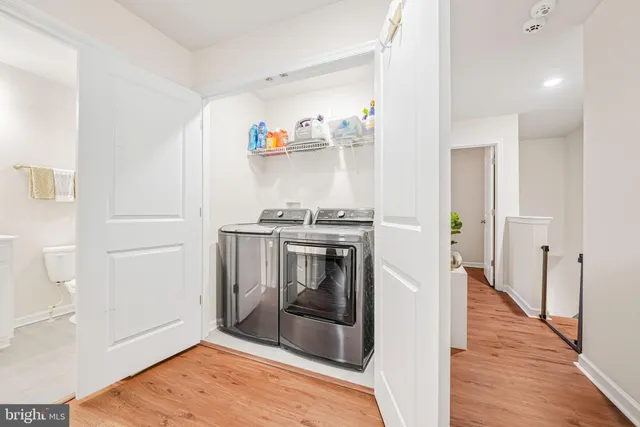 a kitchen with stainless steel appliances granite countertop a refrigerator and a stove