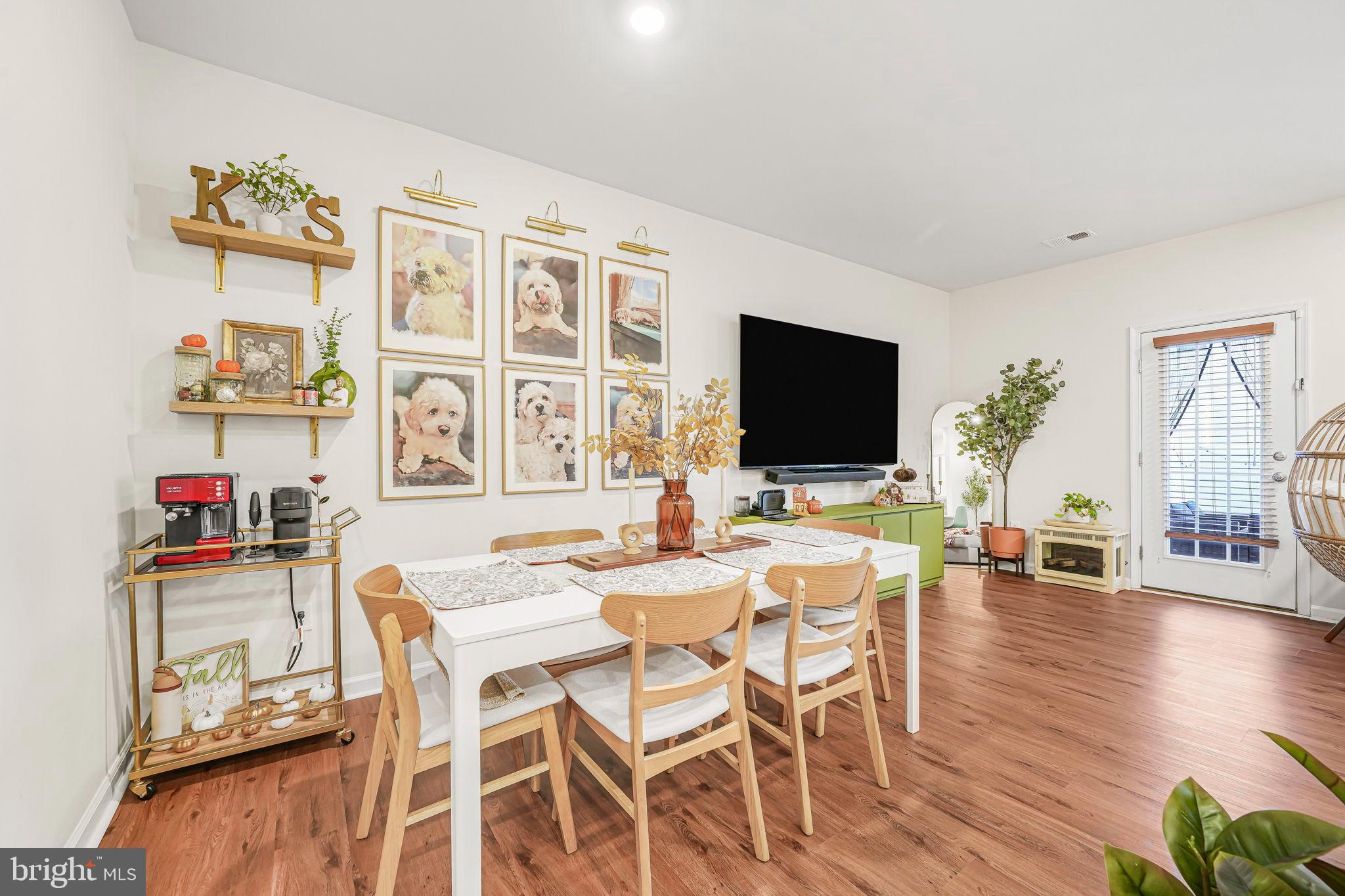 69 Peregrine Way Burlington, NJ 08016 - Photo 7 of 28 a view of a dining room with furniture wooden floor and a flat screen tv