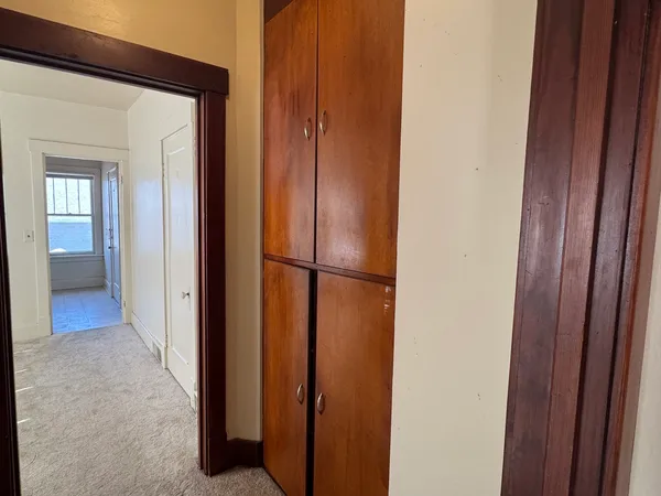 a kitchen with a refrigerator stove and cabinets