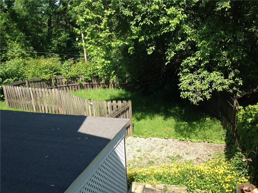 928 Braddock Road Pittsburgh, PA 15221 - Photo 24 of 24 View of the fenced backyard from the kitchen door covered landing.