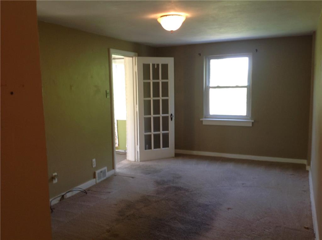 928 Braddock Road Pittsburgh, PA 15221 - Photo 5 of 24 Glass pane door from livingroom to sunroom.