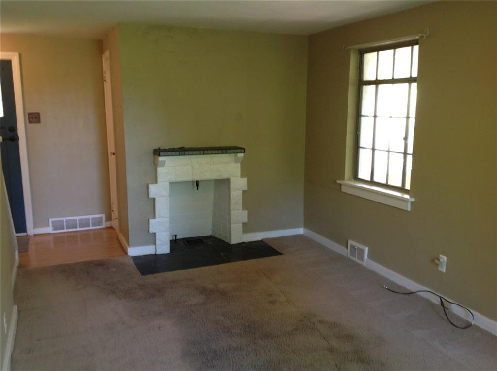928 Braddock Road Pittsburgh, PA 15221 - Photo 6 of 24 Livingroom with fireplace and front entrance.