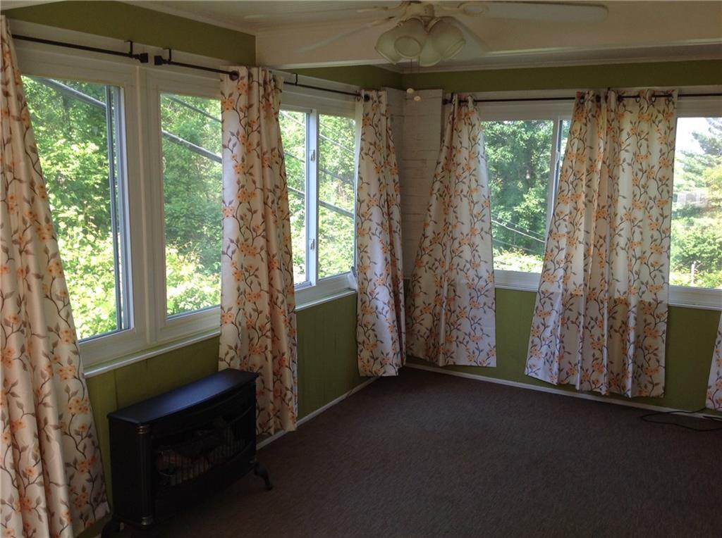928 Braddock Road Pittsburgh, PA 15221 - Photo 8 of 24 Sunroom with gas fireplace.