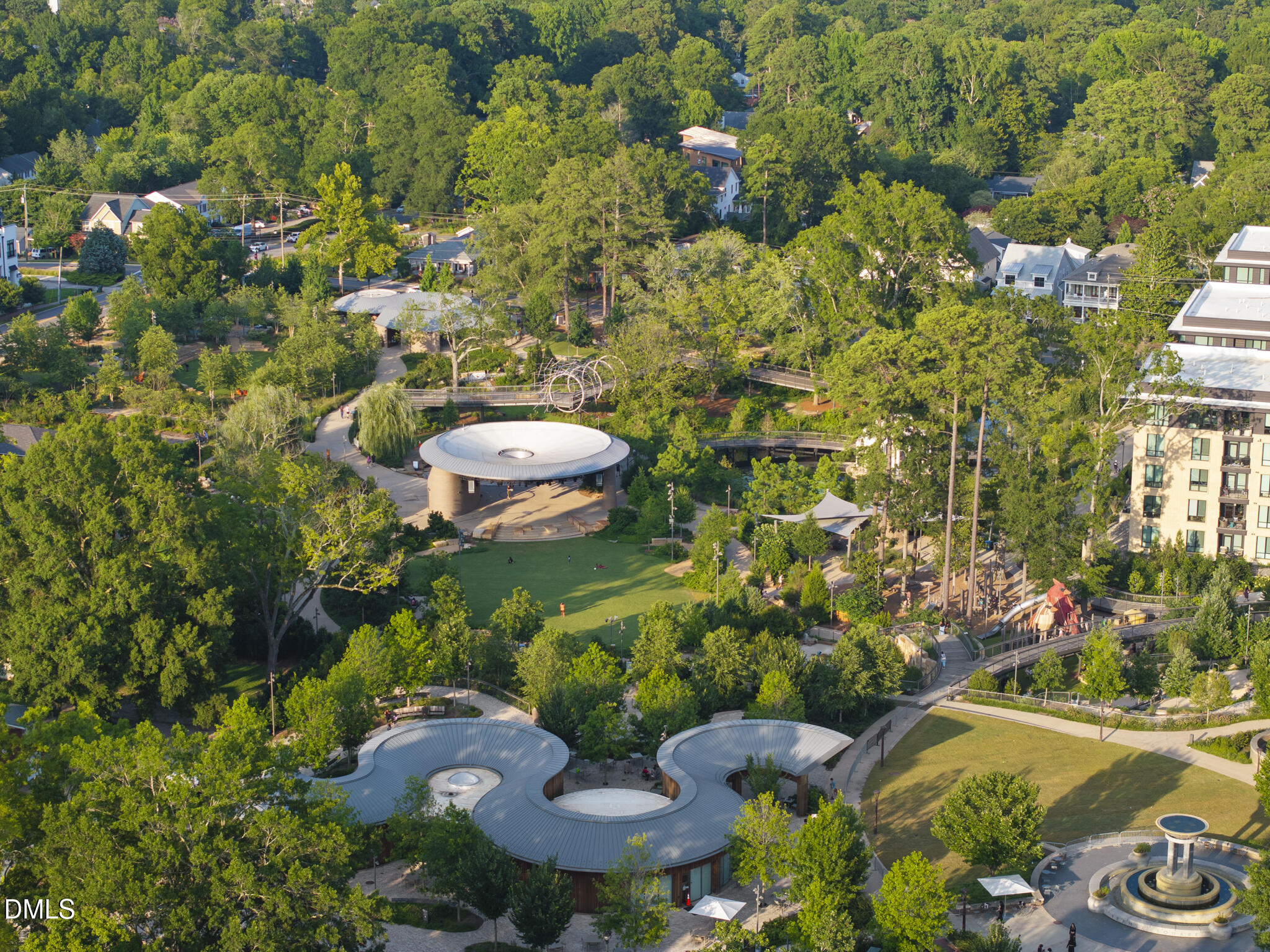 415 Webster Street Cary, NC 27511 - Photo 4 of 6 a view of a garden with a fountain