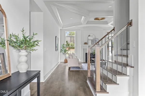 a dining room with furniture a chandelier and window