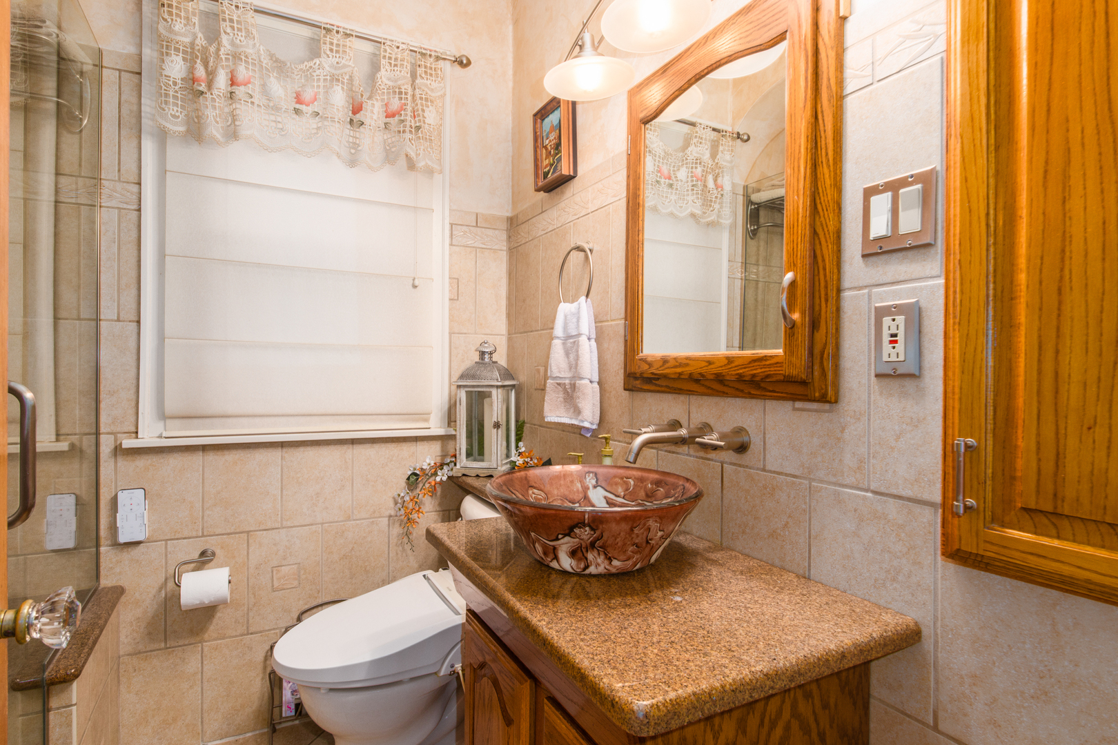 1605 South Fairview Avenue Park Ridge, IL 60068 - Photo 21 of 31 a bathroom with a sink a toilet and mirror