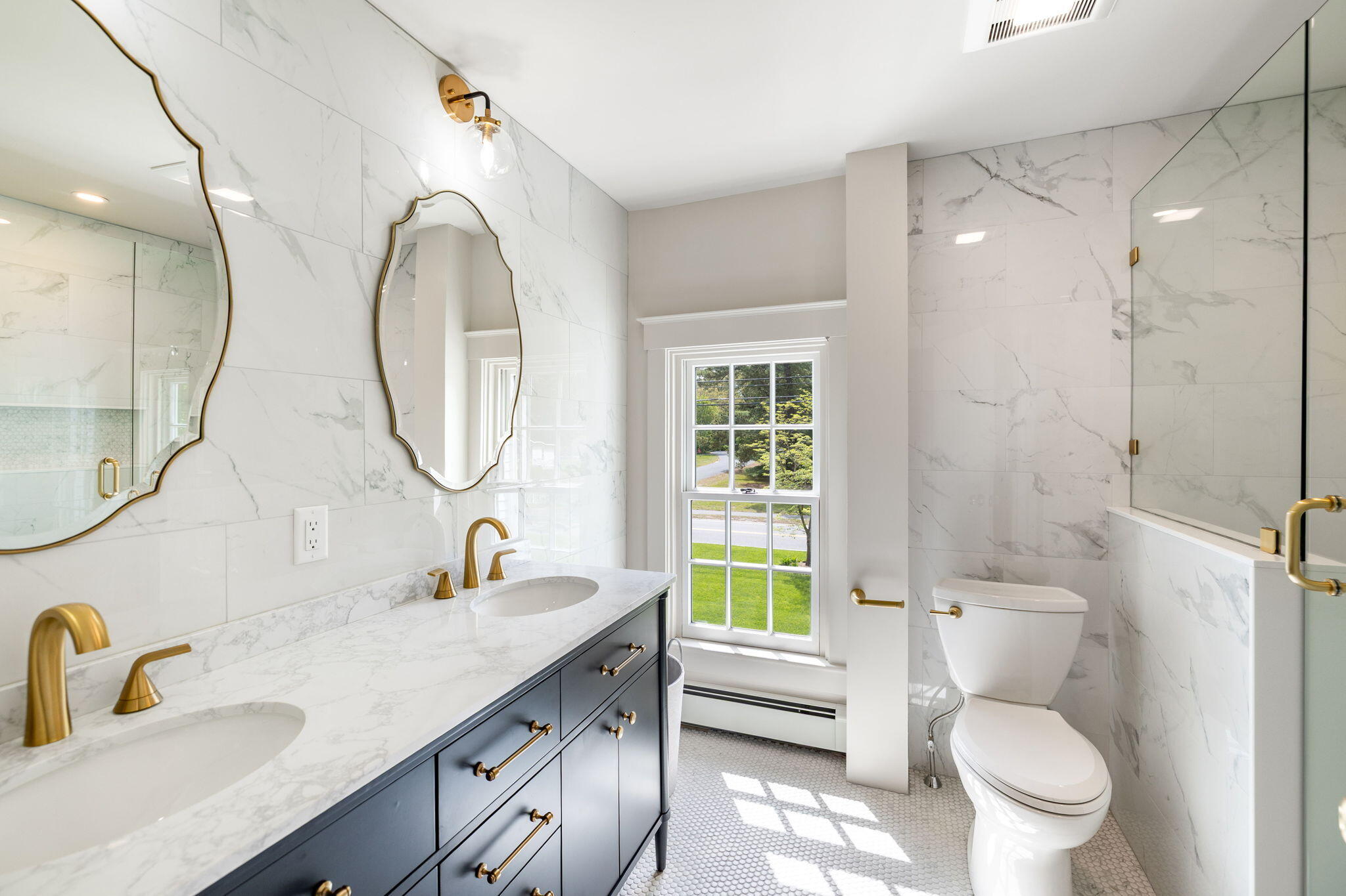 1180 Main Street Cotuit, MA 02635 - Photo 28 of 82 a bathroom with a toilet a sink and a mirror