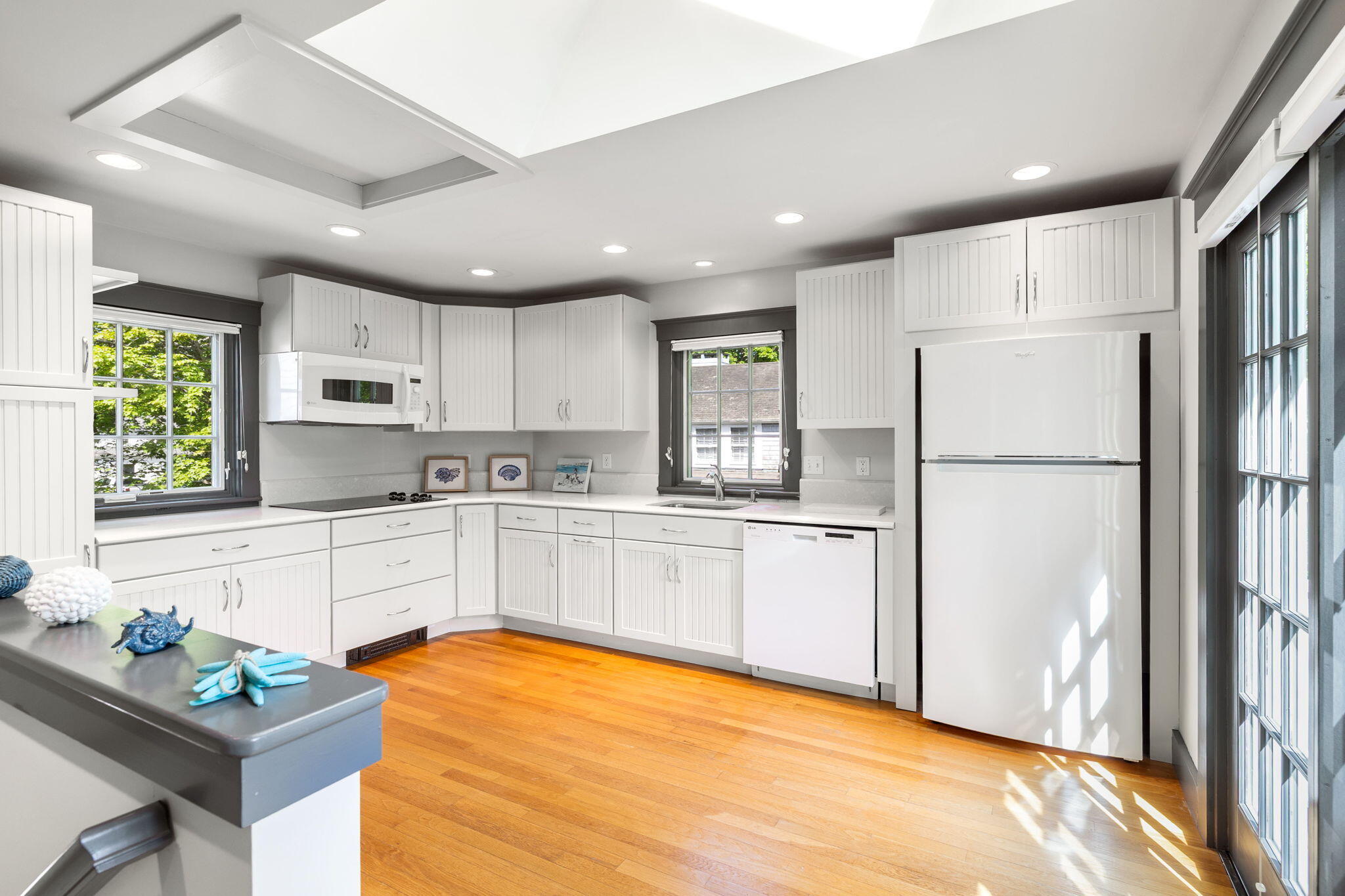 1180 Main Street Cotuit, MA 02635 - Photo 41 of 82 a kitchen with stainless steel appliances a refrigerator sink and microwave