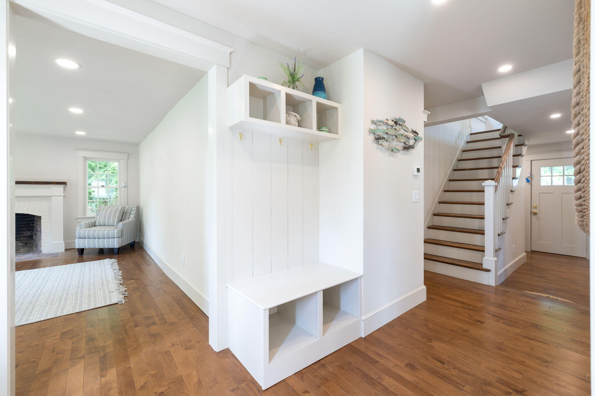 1180 Main Street Cotuit, MA 02635 - Photo 5 of 82 a view of a livingroom with wooden floor and stairs