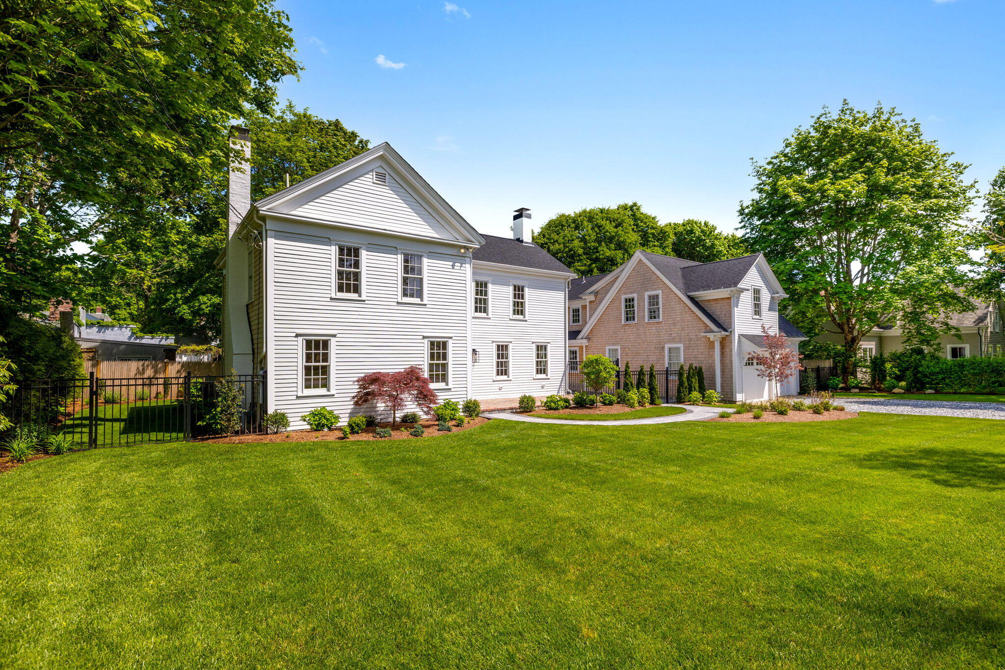 1180 Main Street Cotuit, MA 02635 - Photo 56 of 82 a view of a house with a big yard and large trees