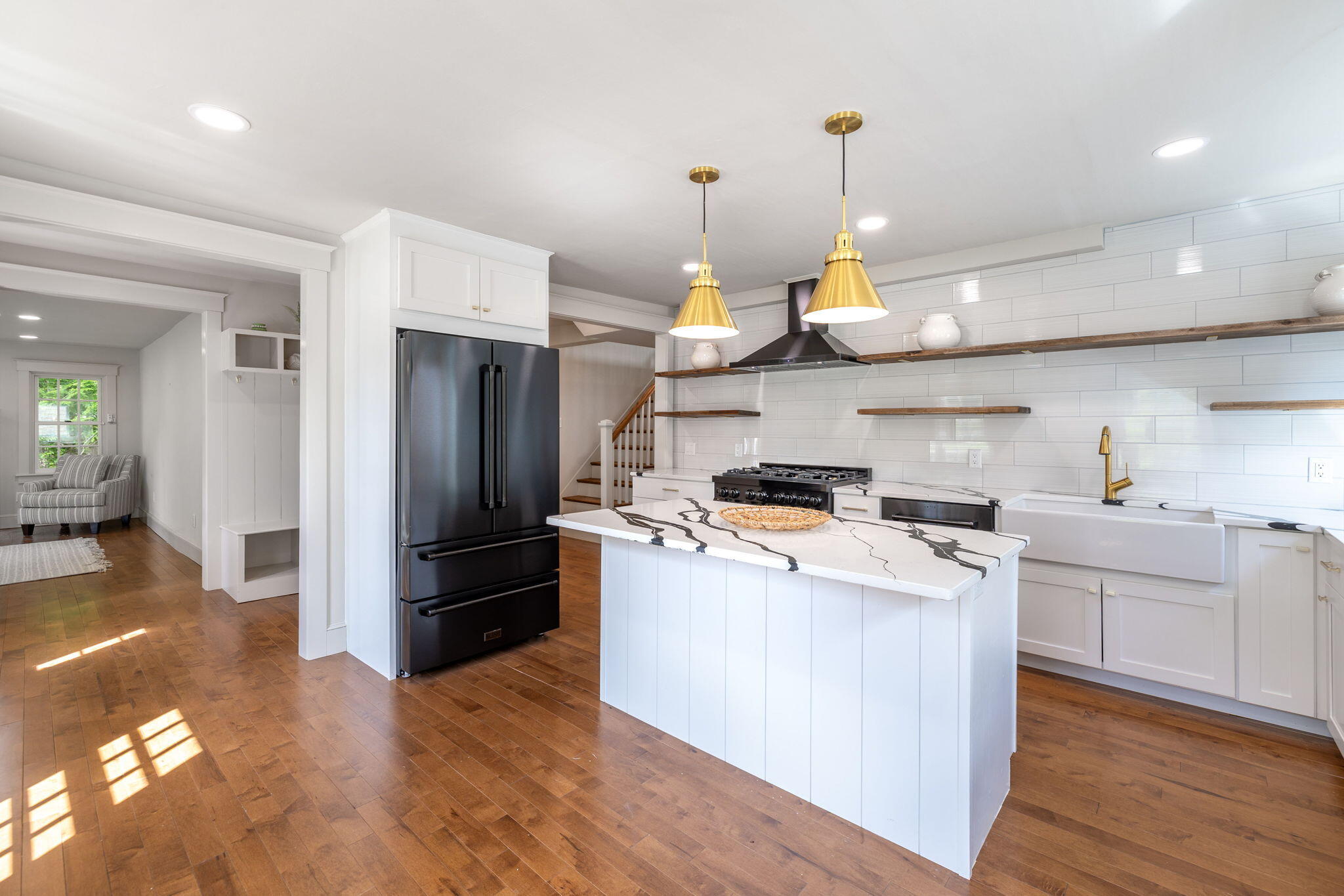1180 Main Street Cotuit, MA 02635 - Photo 7 of 82 a kitchen that has a lot of cabinets and stainless steel appliances