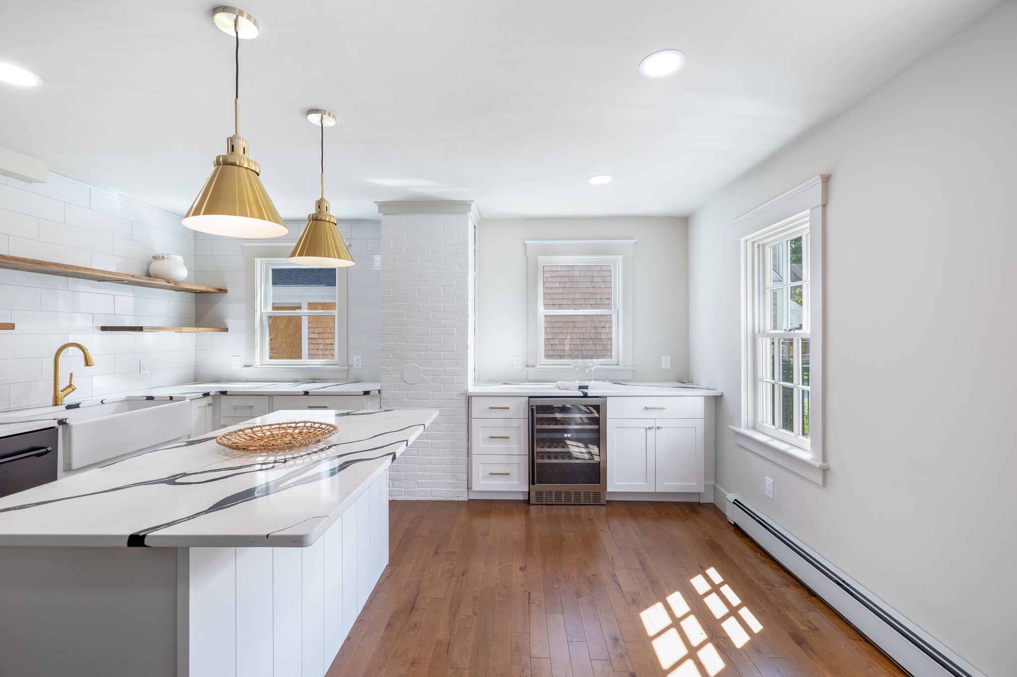 1180 Main Street Cotuit, MA 02635 - Photo 9 of 82 a kitchen with a stove a sink and a refrigerator