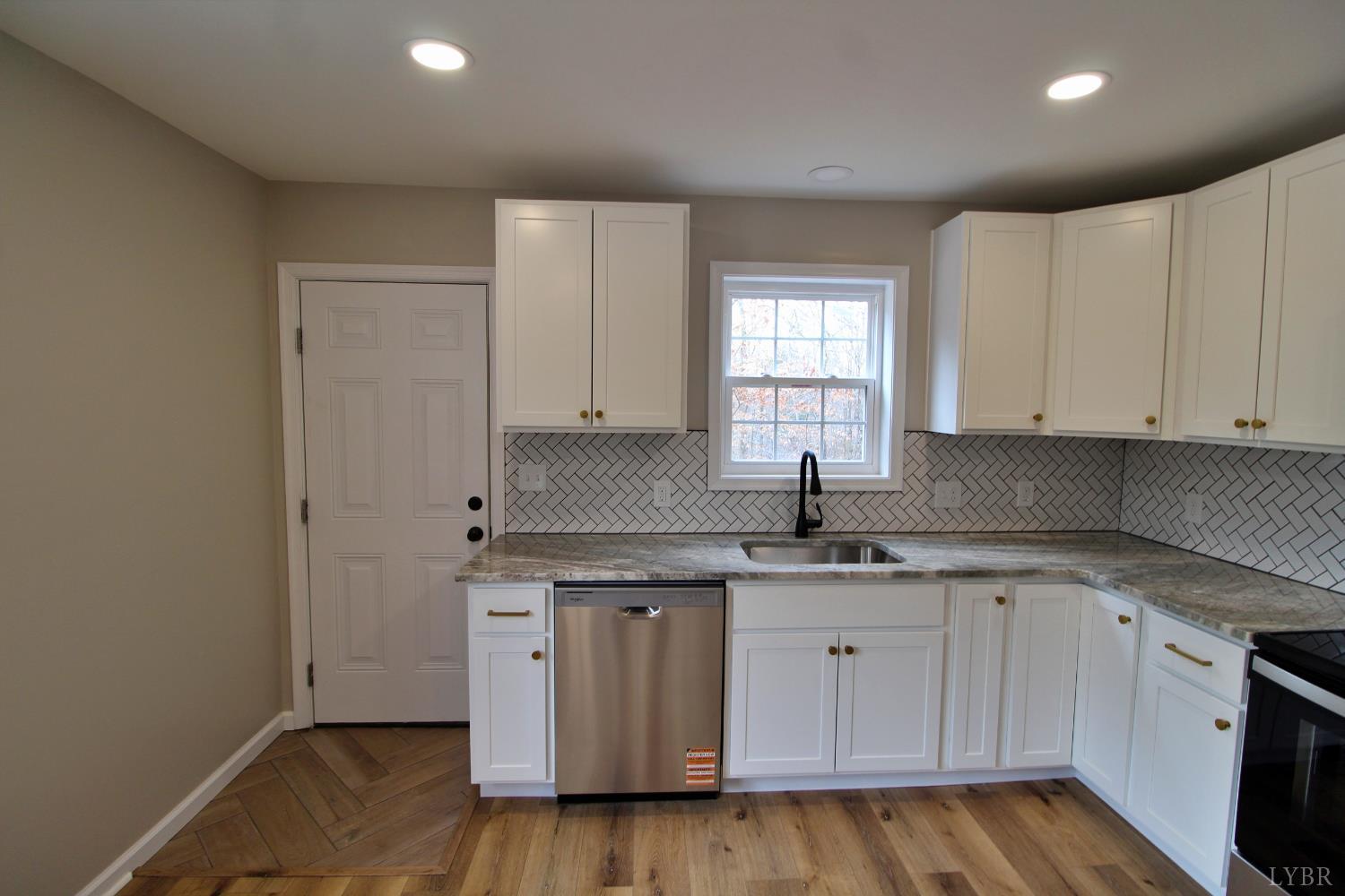 1740 Watt Abbitt Road Appomattox, VA 24522 - Photo 19 of 29 a kitchen with a sink cabinets and window