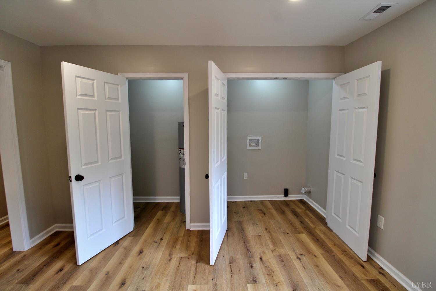 1740 Watt Abbitt Road Appomattox, VA 24522 - Photo 2 of 29 a view of a room with wooden floor