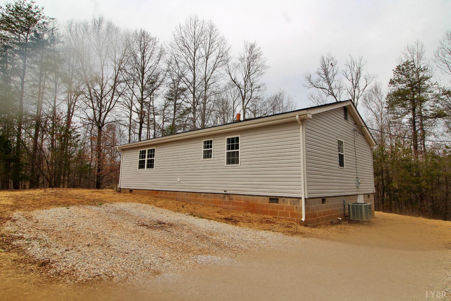 1740 Watt Abbitt Road Appomattox, VA 24522 - Photo 25 of 29 a view of a house with a yard covered in snow