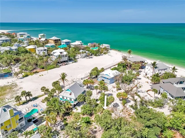 an aerial view of a house with a yard and garden
