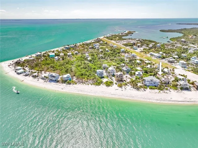 an aerial view of a house with a yard and garden