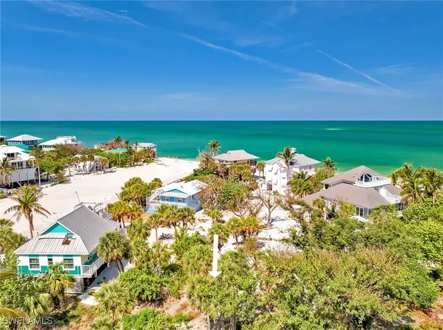 a view of a lake with couches and city view