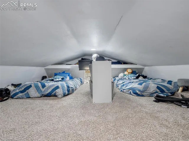 a bed room with a bed and a car