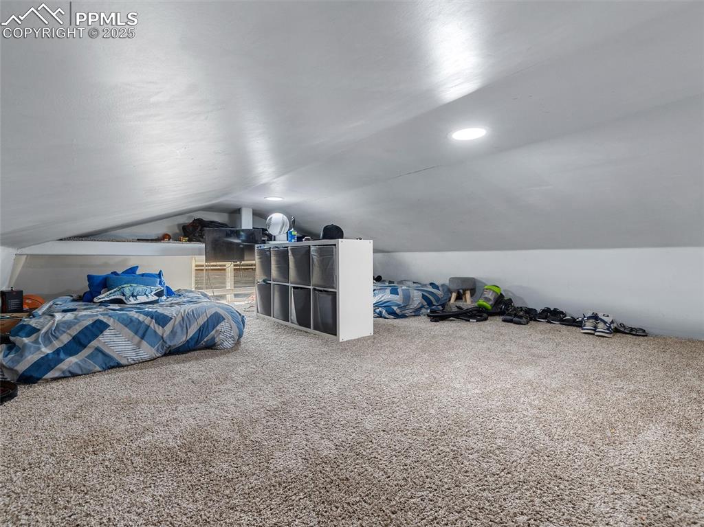 32092 Torrence Road Yoder, CO 80864 - Photo 25 of 44 a bed room with a bed and a view of kitchen