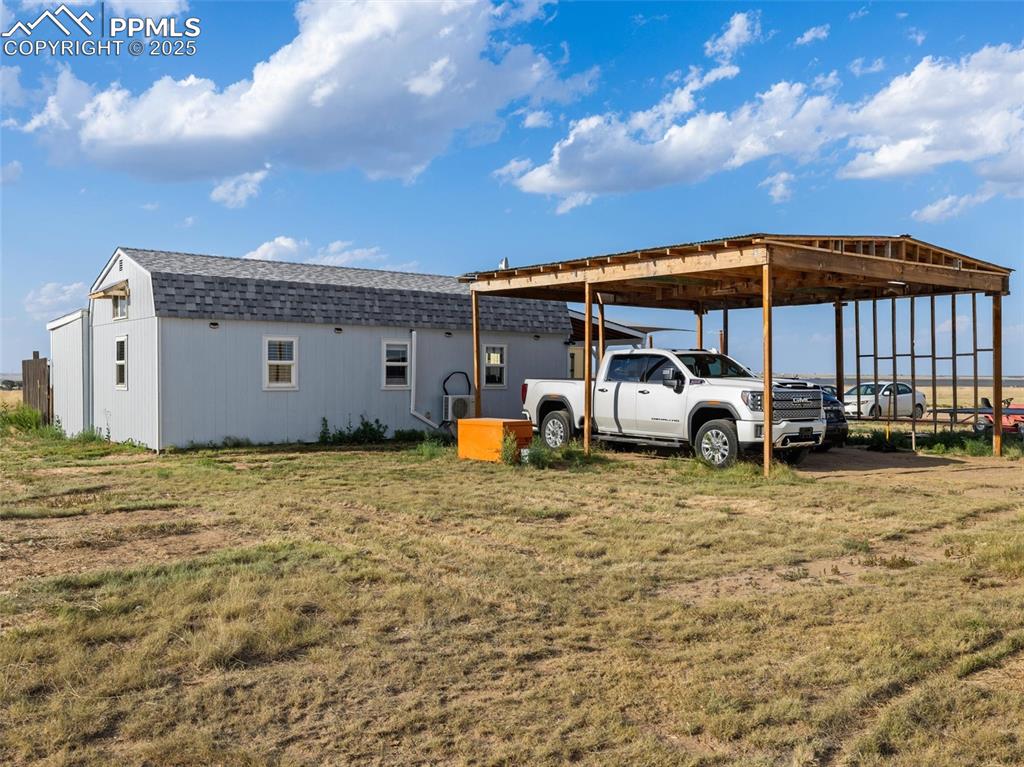 32092 Torrence Road Yoder, CO 80864 - Photo 42 of 44 a house view with a backyard space