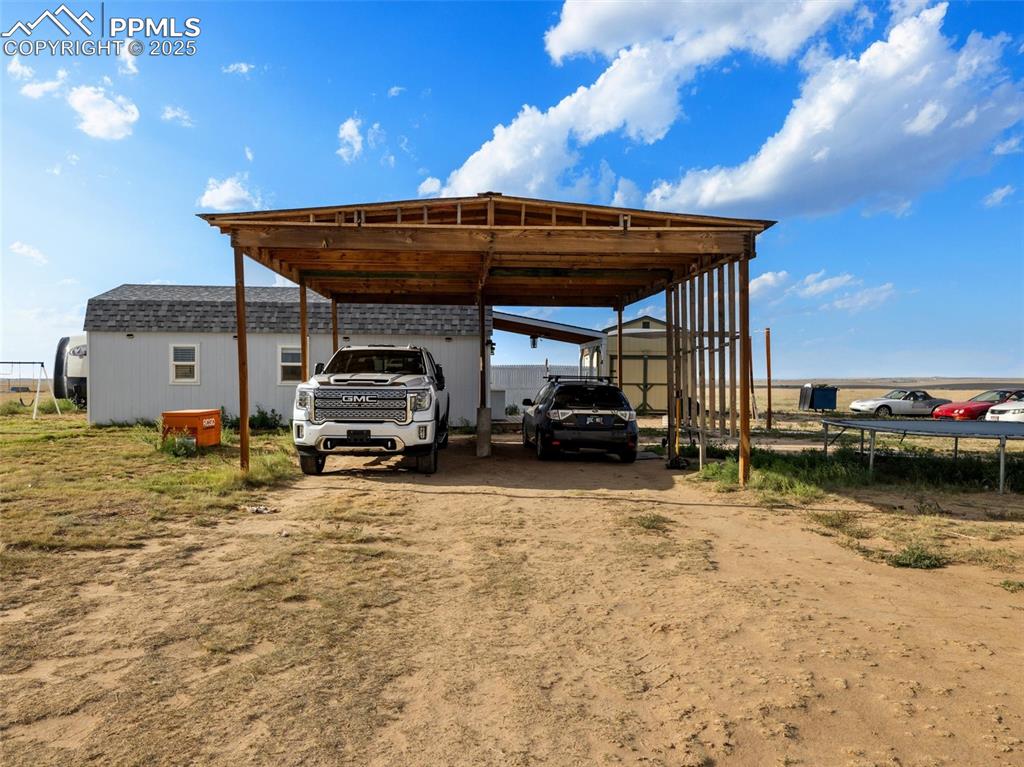 32092 Torrence Road Yoder, CO 80864 - Photo 43 of 44 a car parked in front of a building