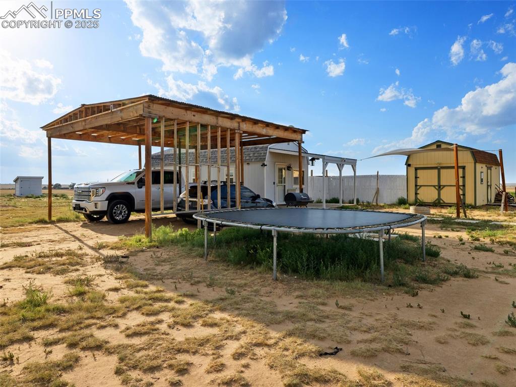 32092 Torrence Road Yoder, CO 80864 - Photo 44 of 44 a view of a house with a yard