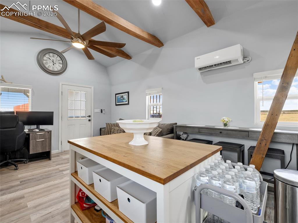 32092 Torrence Road Yoder, CO 80864 - Photo 10 of 44 a view of a kitchen with a table and a stove top oven