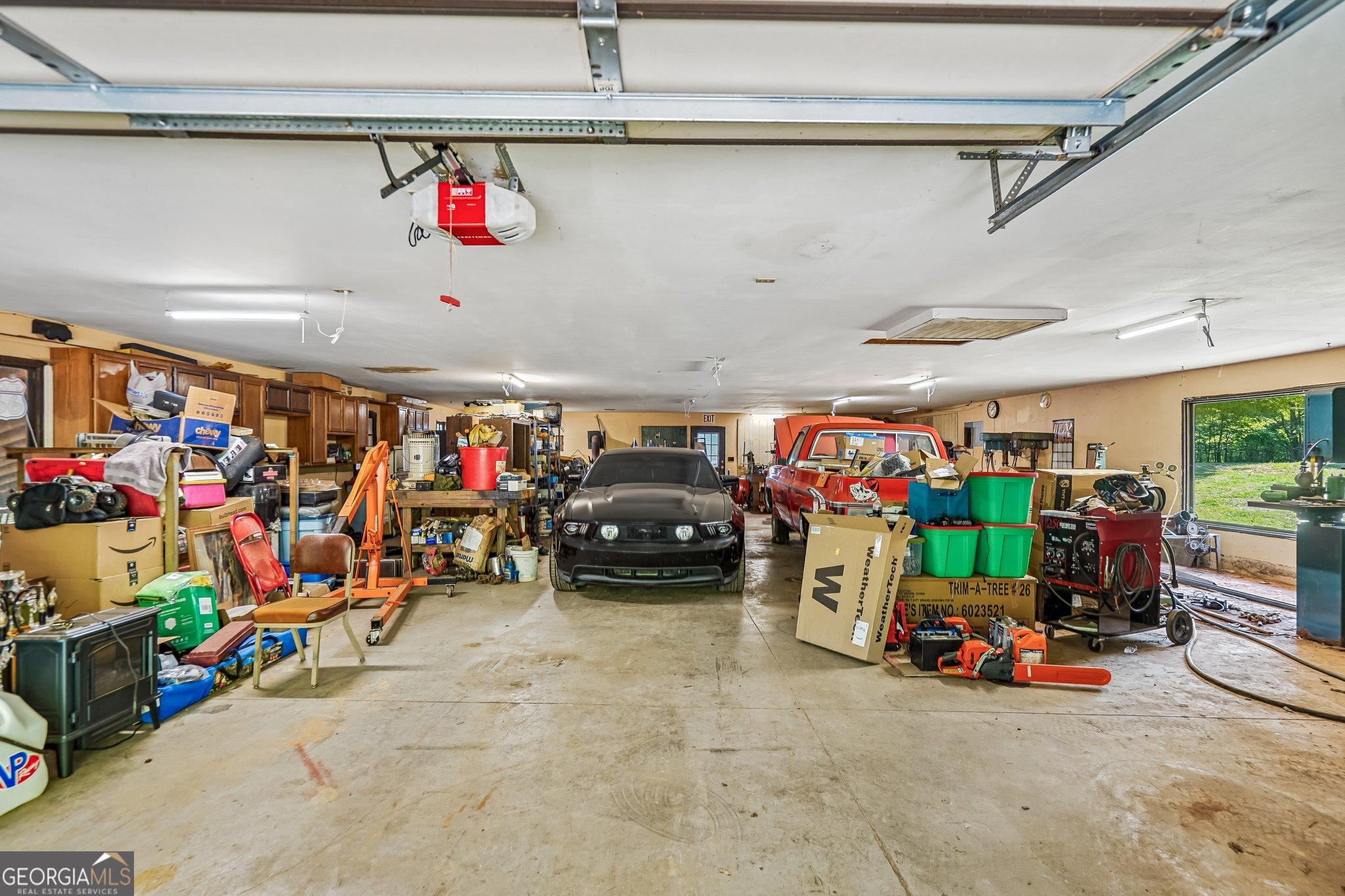 241 Busbin Road Fayetteville, GA 30215 - Photo 33 of 45 a view of a garage with a lot of stuff