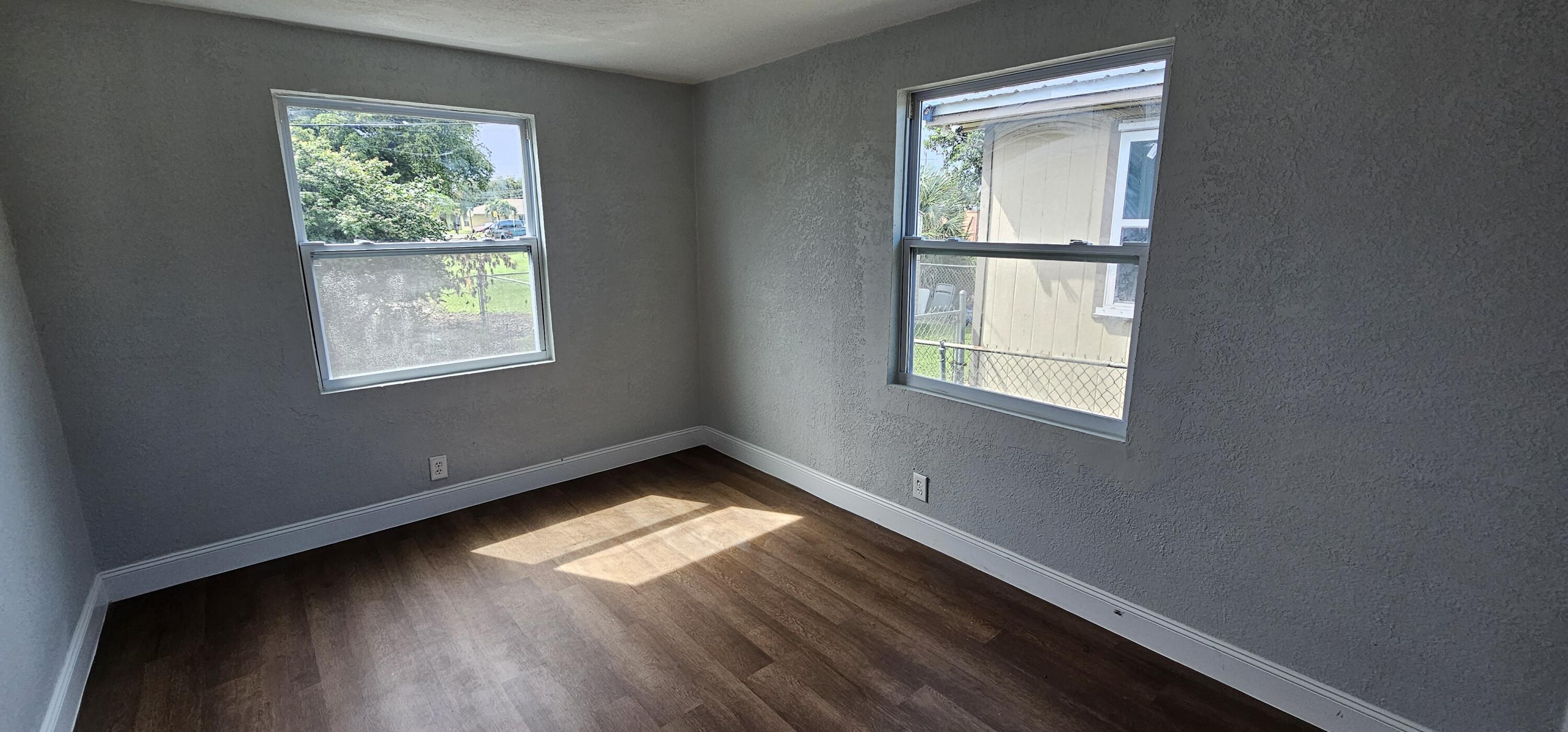 540 Southwest 9th Street Belle Glade, FL 33430 - Photo 18 of 28 a view of an empty room and window