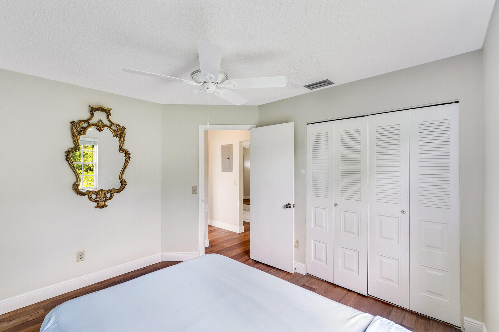 2334 Southeast Merrill Road Port St. Lucie, FL 34952 - Photo 19 of 27 wooden floor in an empty room with a window