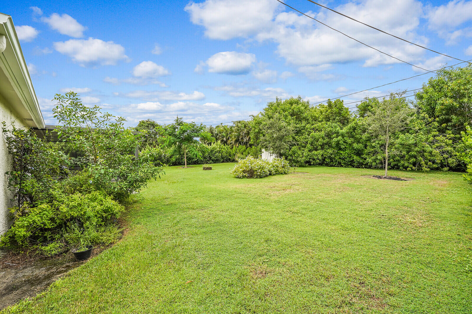 2334 Southeast Merrill Road Port St. Lucie, FL 34952 - Photo 24 of 27 a view of a yard with an outdoor space