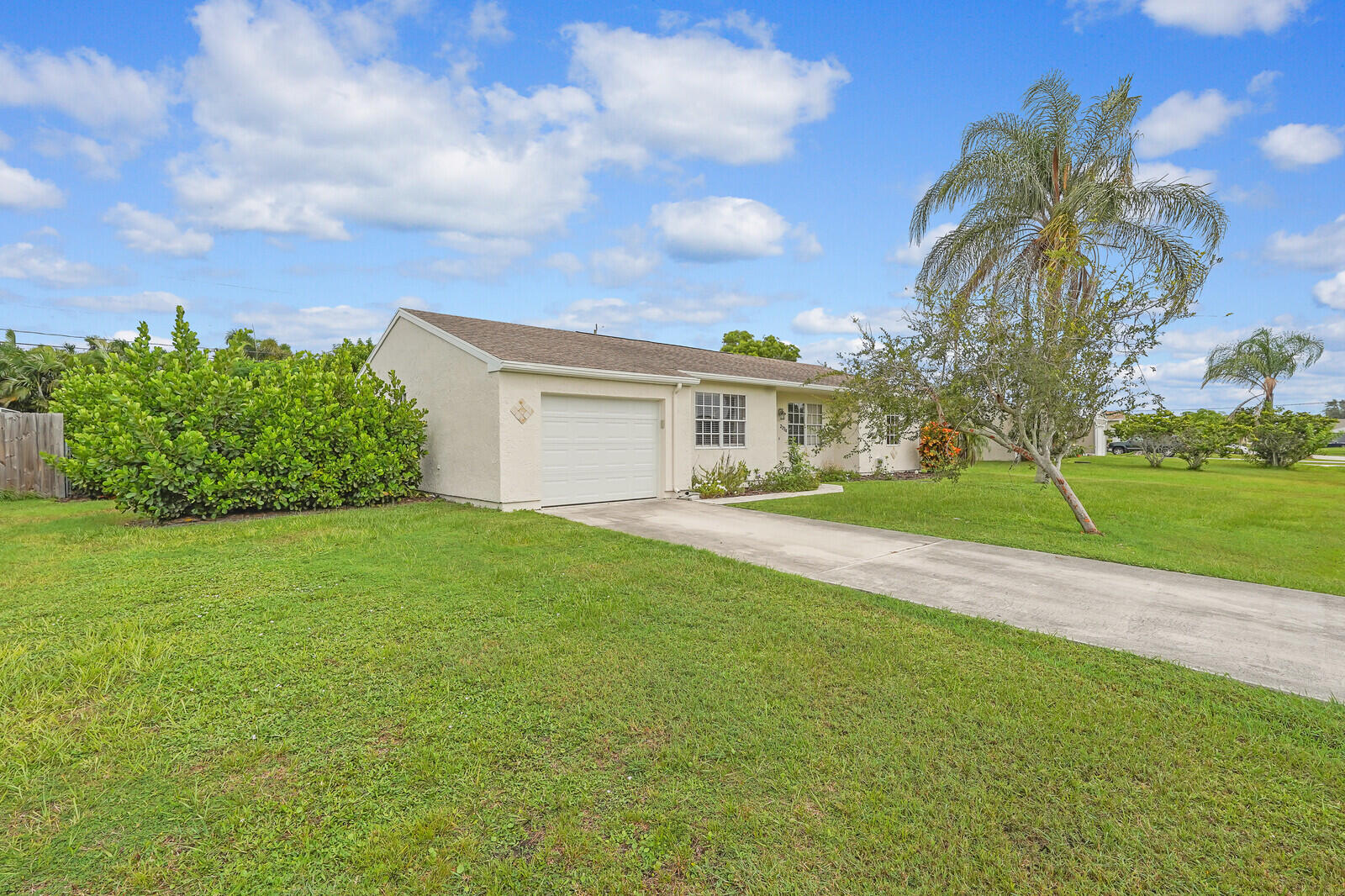 2334 Southeast Merrill Road Port St. Lucie, FL 34952 - Photo 3 of 27 a view of a house with a backyard