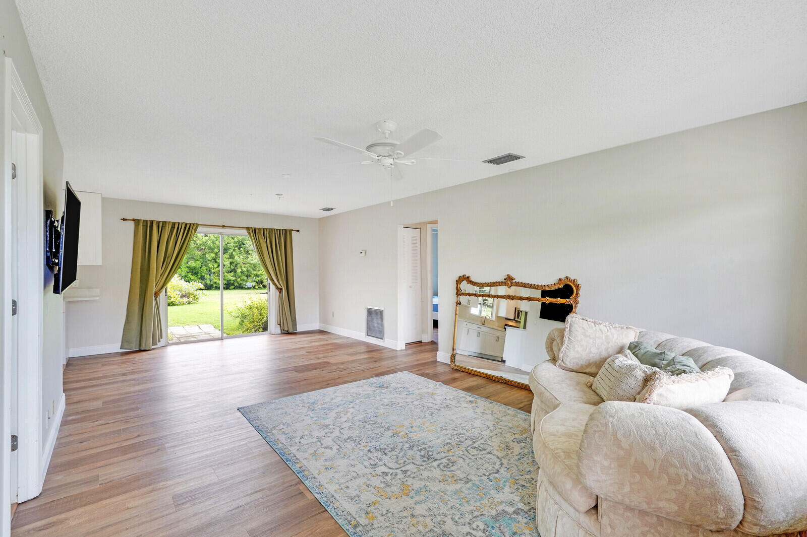 2334 Southeast Merrill Road Port St. Lucie, FL 34952 - Photo 5 of 27 a bedroom with furniture and a large window