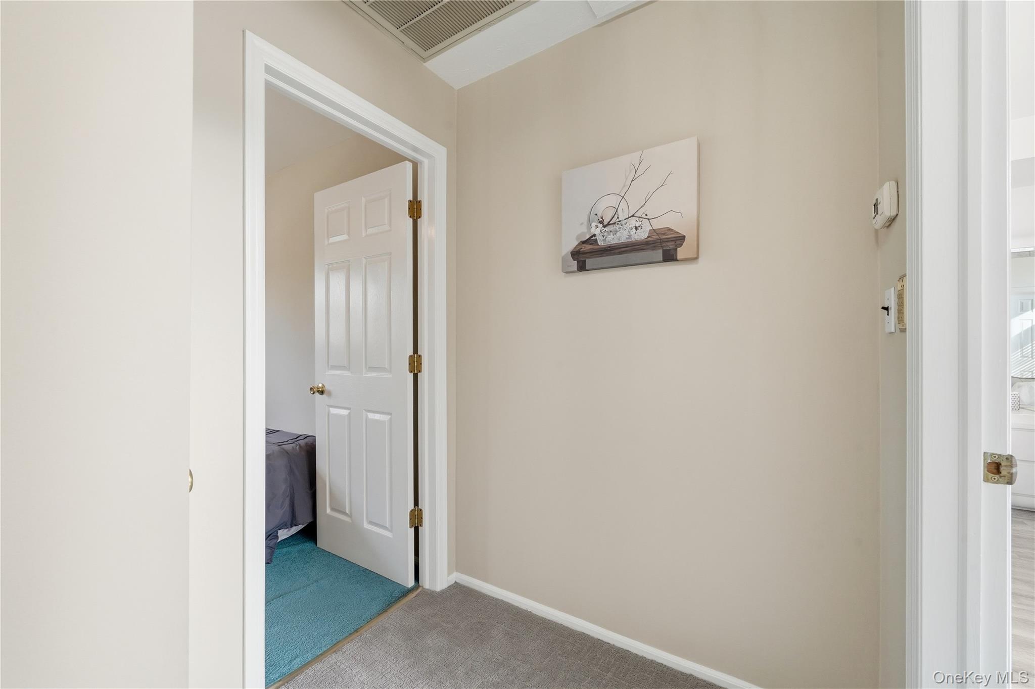 1853 Decatur Avenue Merrick, NY 11566 - Photo 26 of 43 a view of a room that has a bed and a mirror