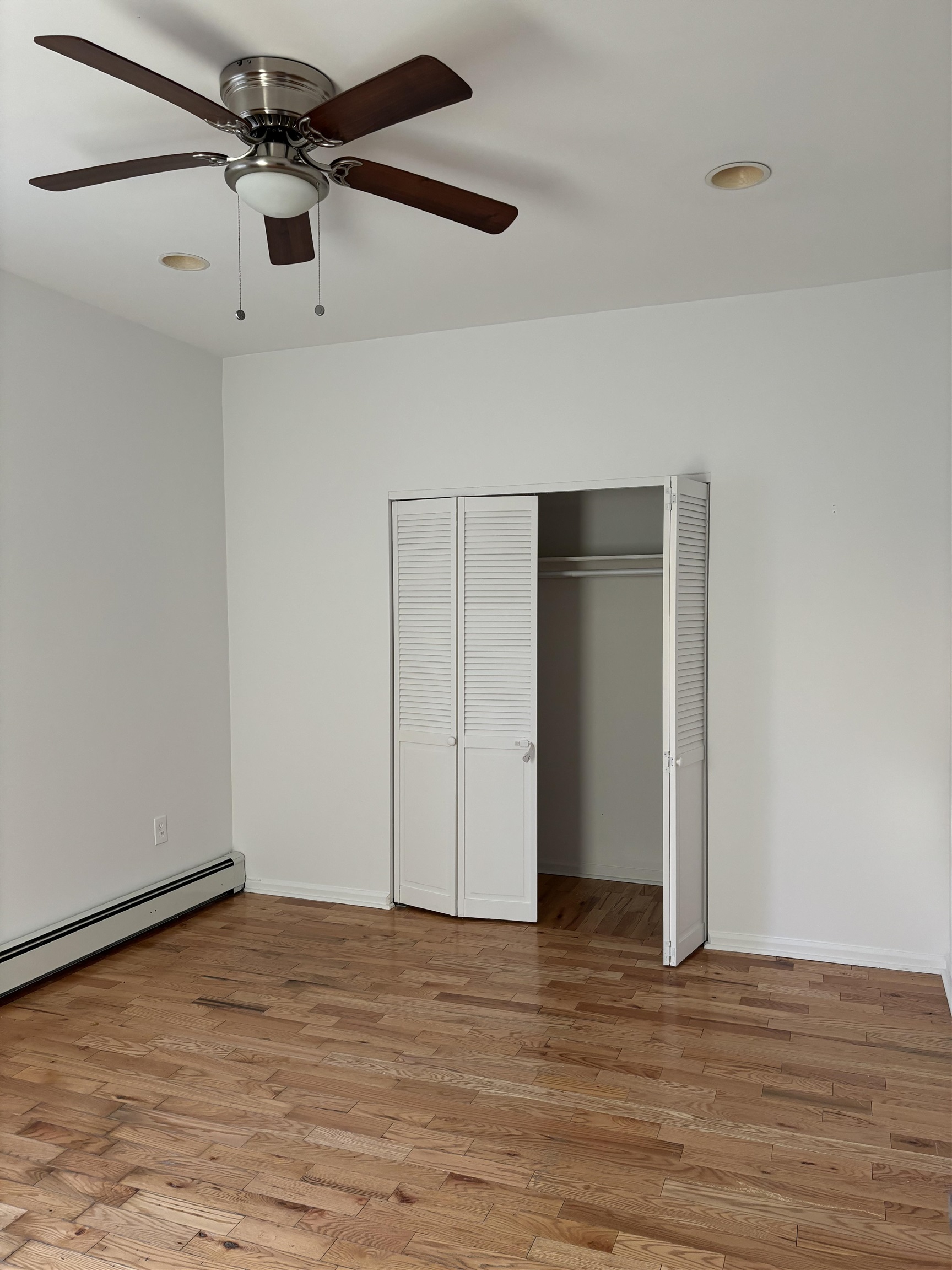 178 Orient Street, Unit 2 Bayonne, NJ 07002 - Photo 7 of 9 a view of a livingroom with wooden floor