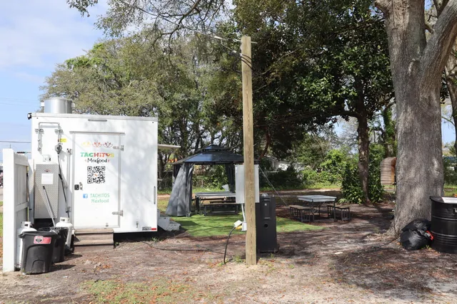 a view of a street with a car park side of the road